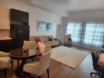 a living room with a couch and a table at Art District Downtown Spacious Homes in Los Angeles