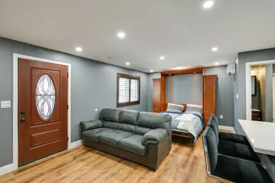 a living room with a couch and a bed at Hidden Gem in Hawthorne about 3 Mi to SoFi Stadium in Hawthorne