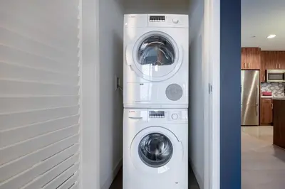 a white washer and dryer in a room at Downtown 1BR w Gym WD next to The Broad LAX-51 in Los Angeles