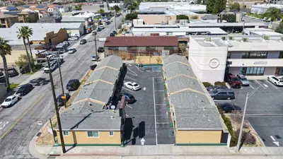 an aerial view of a city street with buildings at SIGNAL HILL MOTEL BEACH MOTEL in Long Beach