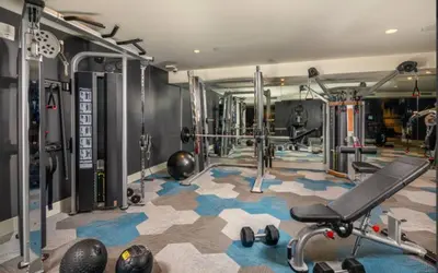 a fitness room with a gym with tread machines at Amber Drift - Santa Monica 2BR Penthouse Ocean views in Los Angeles