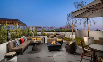a patio with couches and a fire pit at Amber Drift - Santa Monica 2BR Penthouse Ocean views in Los Angeles