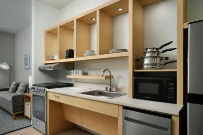 a kitchen with a sink and a microwave at TownePlace Suites by Marriott Marriott Barstow in Barstow