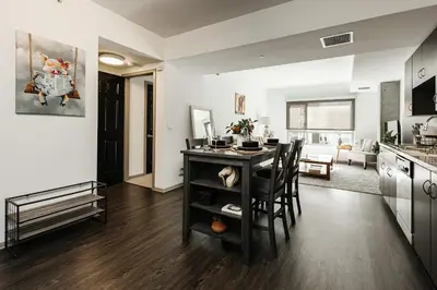 a kitchen and living room with a table and chairs at Oasis in heart of Hollywood in Los Angeles