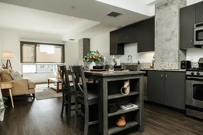 a kitchen with a table and chairs in a room at Oasis in heart of Hollywood in Los Angeles