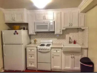 a kitchen with white appliances and white cabinets at Echo Park Studio Oasis with Modern Comforts in Los Angeles
