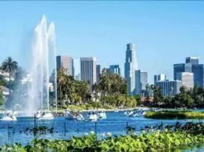 a fountain in the middle of a river with a city at Victorian Charm Meets Echo Park Vibes: Timeless Bungalow Retreat in Los Angeles