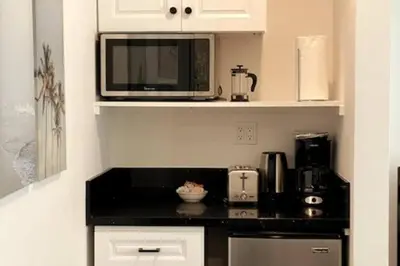 a kitchen with a microwave and a counter top at House on The Beach in Los Angeles