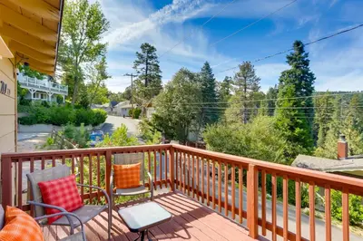 a balcony with chairs and a view of a street at Crestline Cabin Close to Lake Arrowhead and Skiing in Crestline