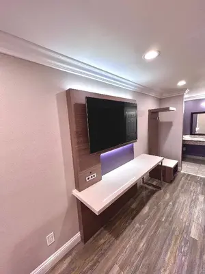 a room with a flat screen tv on a wall at Paradise Inn-Montebello,Los Angeles in Montebello