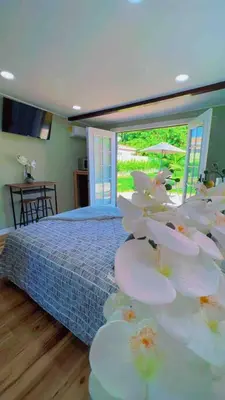 a bedroom with a bed with plates on a table at Bonito descanso LAX 10 min SOFI 5 min in Hawthorne