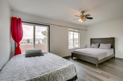a bedroom with a bed and a window at Family Helendale Home - Private Dock and Fire Pit! in Helendale
