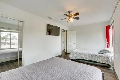 a bedroom with two beds and a ceiling fan at Family Helendale Home - Private Dock and Fire Pit! in Helendale