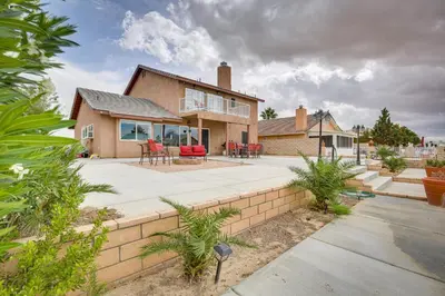 a home with a patio and a house at Family Helendale Home - Private Dock and Fire Pit! in Helendale