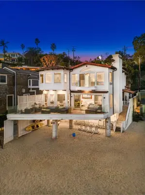 a large white house on the beach at night at Escondido Escape in Malibu