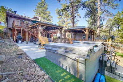 a house with a deck with a hot tub at 1 Mi to Lake Home with Hot Tub and Gazebo in Big Bear in Big Bear Lake