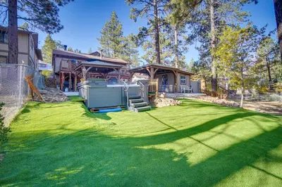 a yard with a fence and a house at 1 Mi to Lake Home with Hot Tub and Gazebo in Big Bear in Big Bear Lake