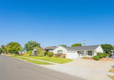 a house on the side of a street with a driveway at Retreat Minutes To LAX, Manhattan/ Redondo Beach in Torrance