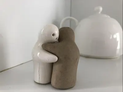 two figurines of two people embracing each other at Dogtown Loft in Los Angeles