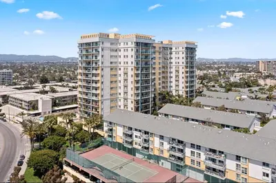 an aerial view of a building with a tennis court at Amber Tide - Bright 1BR Marina Gem Ocean View in Los Angeles