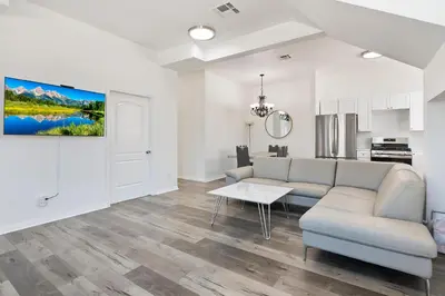 a living room with a couch and a table at Spacious Private gated modern loft close to Universal Studio and Hollywood in Los Angeles