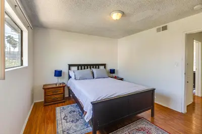 a bedroom with a large bed and a window at 3 Mi to Universal Studios North Hollywood Home in North Hollywood
