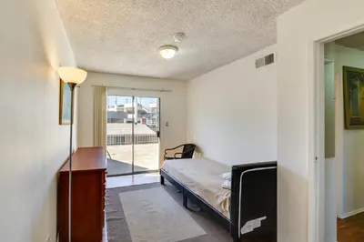 a bedroom with a bed and a sliding glass door at 3 Mi to Universal Studios North Hollywood Home in North Hollywood