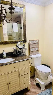a bathroom with a sink and a toilet and a mirror at Private Room View Gated 2Acre Estate - Female Share Indoor - Men Share Outdoor - SD in Encino