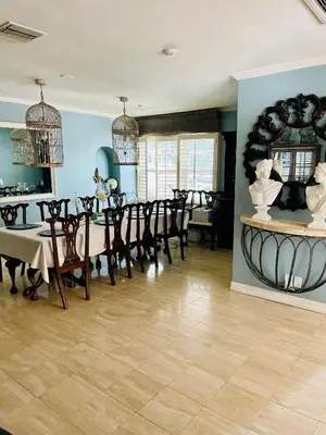 a dining room with a table and chairs at Private Room View Gated 2Acre Estate - Female Share Indoor - Men Share Outdoor - SD in Encino