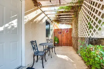 a patio with three chairs and a table and a door at Cozy Simi Valley Studio Less Than 10 Mi to Hiking and Golf in Simi Valley