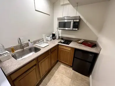 a kitchen with a sink and a microwave at Holiday at Halliday in Los Angeles
