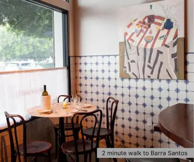 a restaurant with two tables and chairs and a window at Serene Studio, Yurt Barn near DTLA Silverlake in Glendale