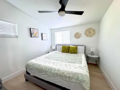 a bedroom with a bed and a ceiling fan at Disneyland Retreat-Pool Spa Game in Anaheim