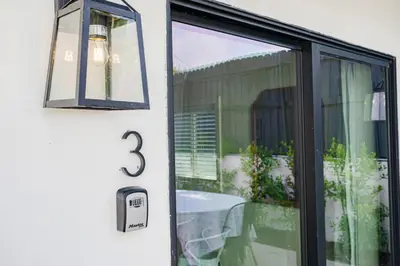 a door with a number on it next to a table at Elegant Guest unit Universal sleeps 6 hot tub in Los Angeles