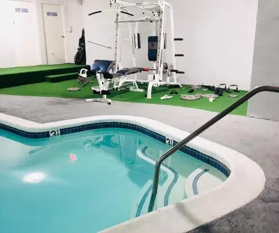 a swimming pool in a room with a barber shop at Lovely Sherman Oaks Studio in Los Angeles
