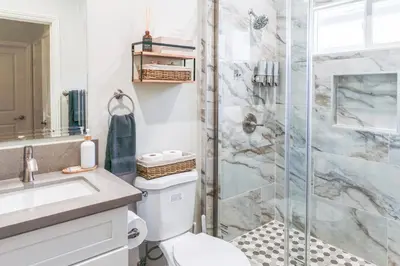 a bathroom with a toilet and a shower at Cozy Luxe Unit Near Disneyland - Sleeps up to 10! EV Friendly & King Bed in Midway City