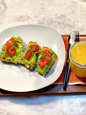 a plate with two slices of bread with tomatoes on it at Resort Getaway in Private Garden Terrace Villa w Luxury Amenities in Los Angeles