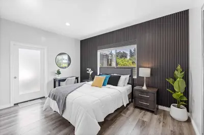 a bedroom with a large bed and a window at Stylist Home In Convenient Location! in Temple City