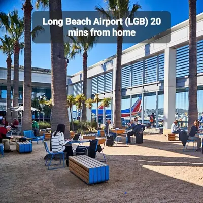 a group of people sitting at tables in front of a building at Amazing Value with High Comfort, 14 Guests for 4BR by Disneyland, Beaches, Rodeo 39 & More in Midway City