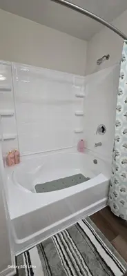 a white bath tub in a bathroom at Large two-room apartment near LAX and the Ocean in Los Angeles