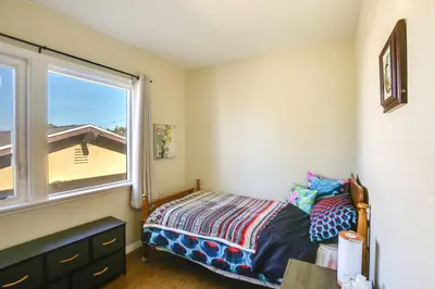 a bedroom with a bed and a window at Lakewood Home about 5 Mi to Knotts Berry Farm! in Lakewood