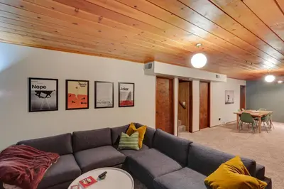 a living room with a couch and a table at Crestline Cabin Mountain Views and Fire Pit! in Crestline