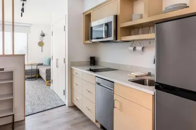 a small kitchen with a sink and a microwave at TownePlace Suites by Marriott Monrovia in Monrovia