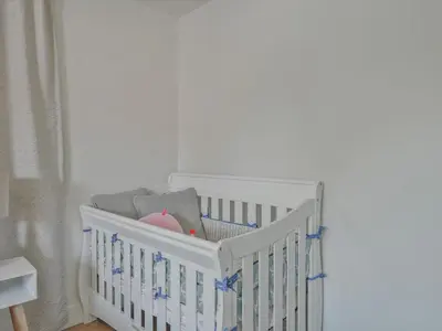 a white crib in a baby room with a crib at Hollywood Dream pool home & king beds in Los Angeles