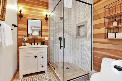 a bathroom with a shower with a sink and a toilet at Gold Rush Lodge Big Bear~Hot Tub~ Games~ in Big Bear Lake