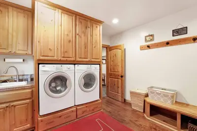 a laundry room with a washer and dryer at Gold Rush Lodge Big Bear~Hot Tub~ Games~ in Big Bear Lake