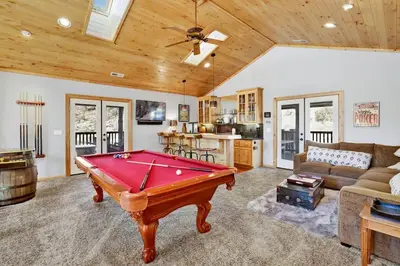 a living room with a pool table in it at Gold Rush Lodge Big Bear~Hot Tub~ Games~ in Big Bear Lake