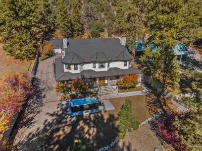 an overhead view of a house with a swimming pool at Mountain High Luxury Castle &Spa in Wrightwood