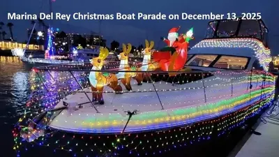 a boat covered in christmas lights on the water at Harbor Views Retreat By Venice Beach In Marina DR in Los Angeles