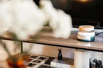 a bottle of medicine sitting on a shelf at Elegant Apartment in the Heart of Hollywood in Los Angeles